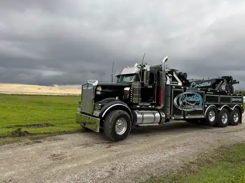 Coastal Towing Kenworth wrecker on rural road
