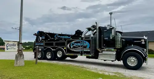 Coastal Towing wrecker parked at the yard